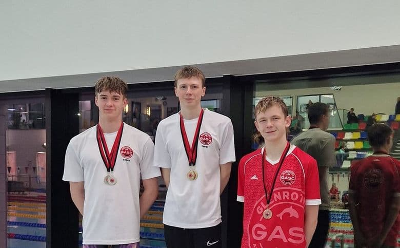 Some champions standing on the podium after receiving their medals.